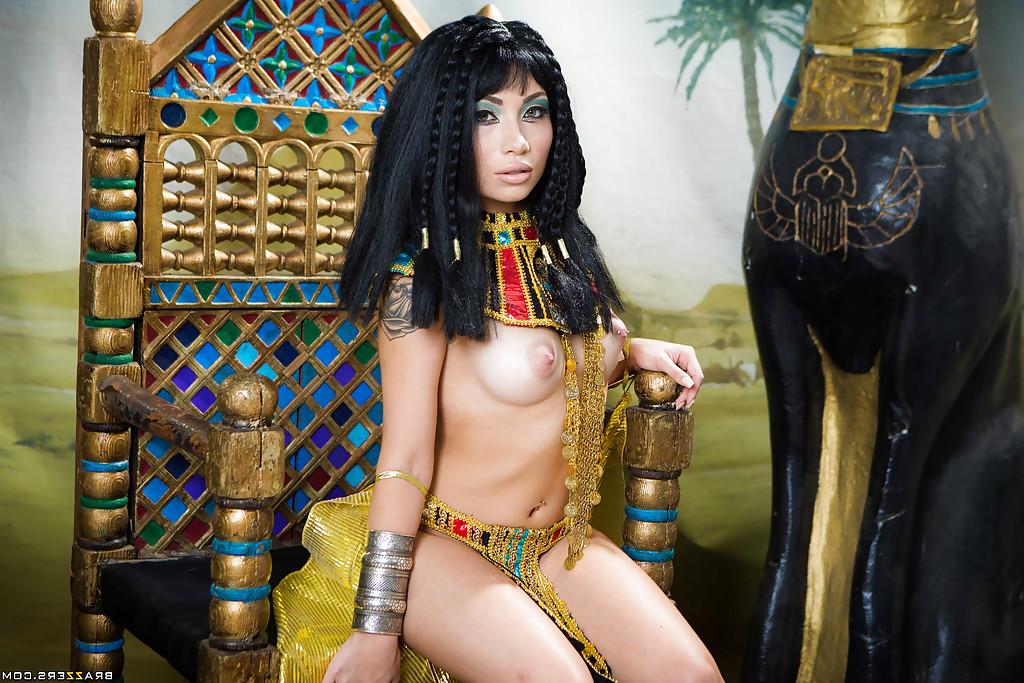 16P Brunette coed Rina Ellis peeling off Cleopatra themed cosplay outfit