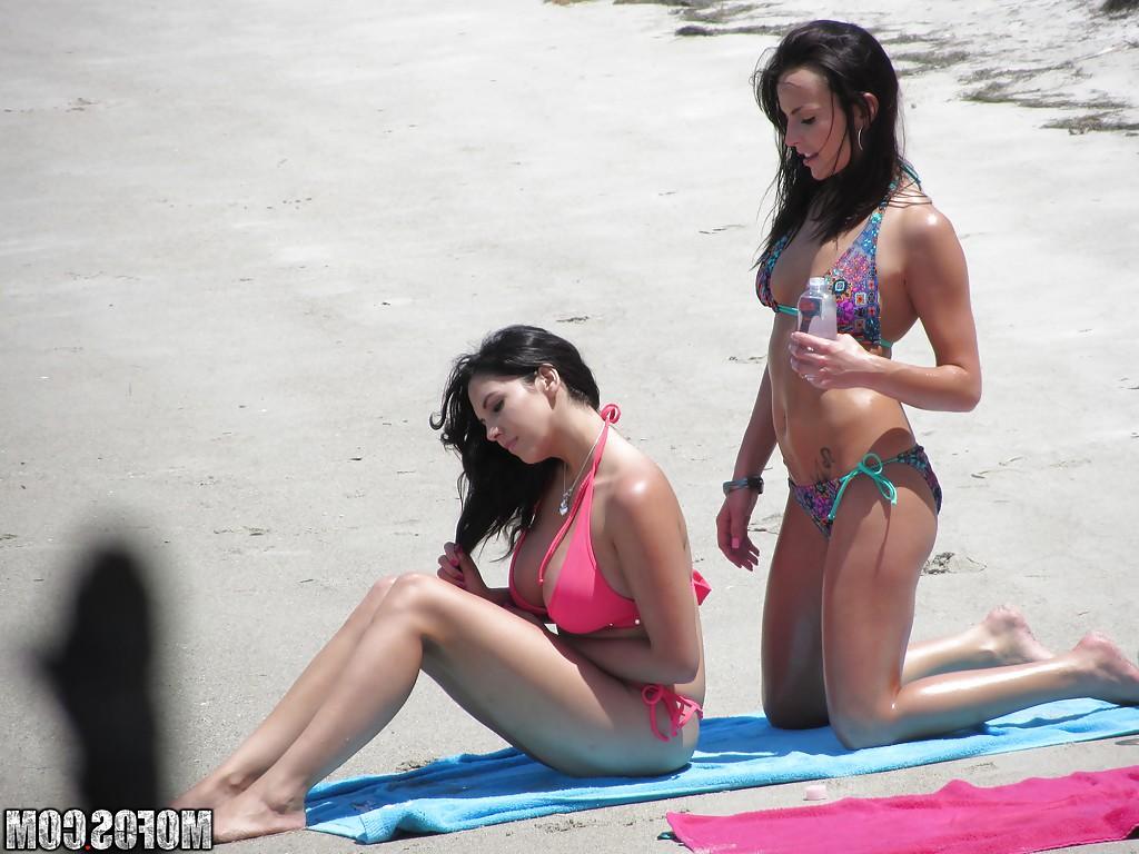 16P Sassy brunettes get caught on voyeur video having some fun on the beach
