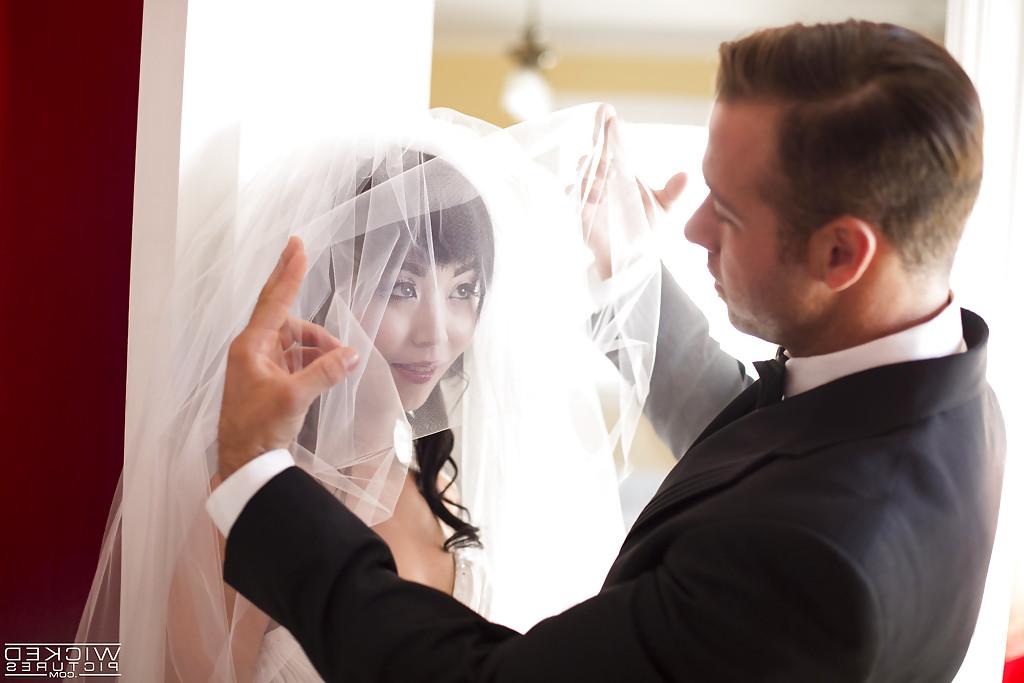 14P Beautiful Oriental chick Marica Hase giving blowjob in wedding dress