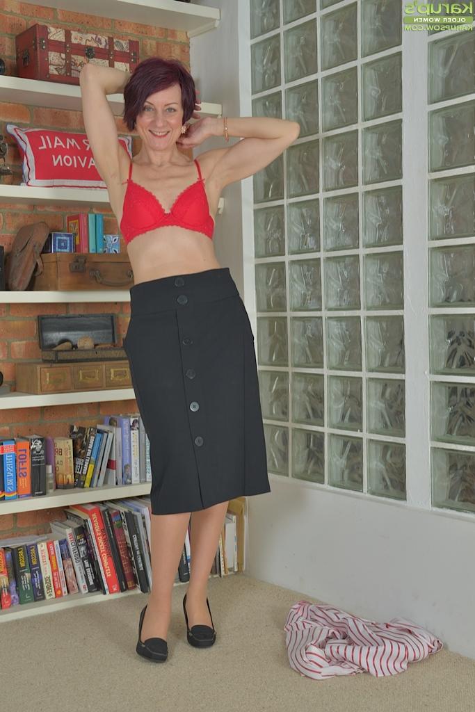 16P Naughty short haired woman Penny Brooks lubing dildo for insertion