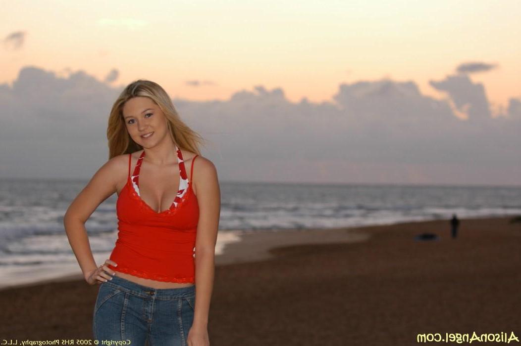 20P Pictures of teen girl Alison Angel flashing her tits on a beach