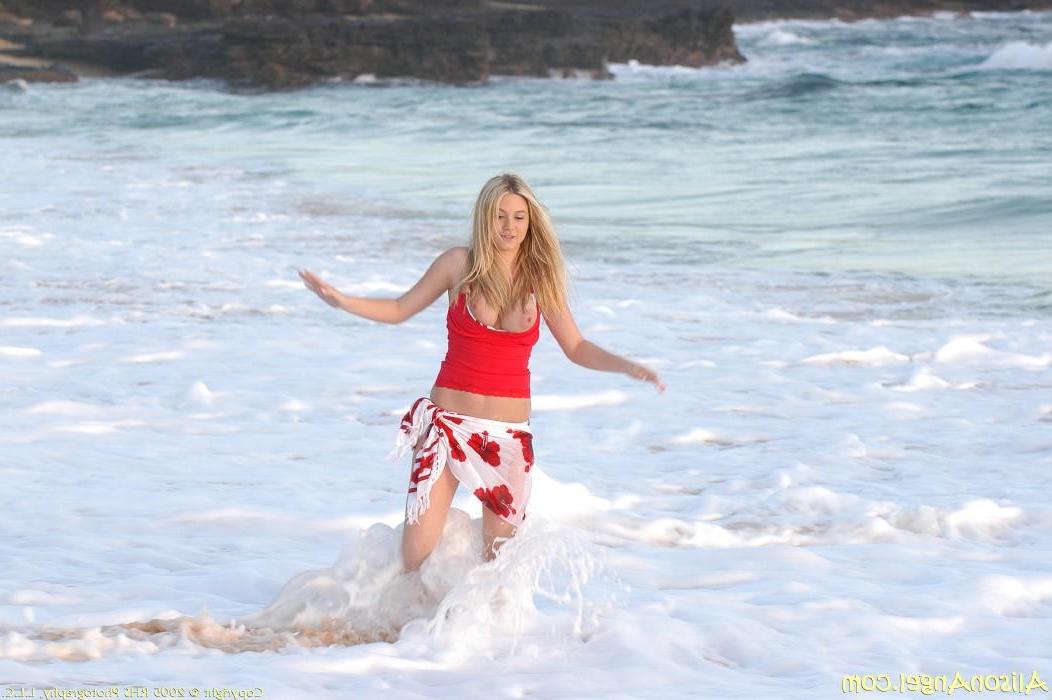 20P Pictures of teen girl Alison Angel flashing her tits on a beach