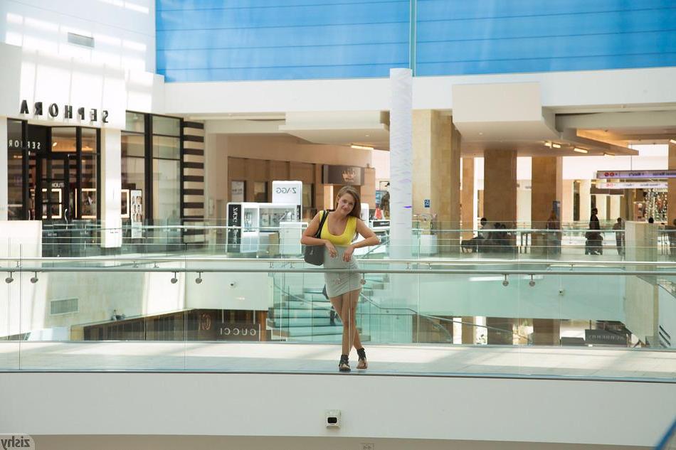 8P Hot coed April Brookes gives you some peeks up her skirt at a public mall