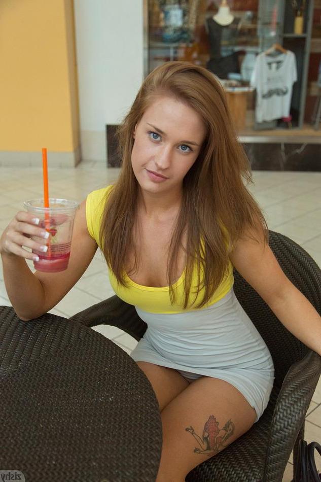 8P Hot coed April Brookes gives you some peeks up her skirt at a public mall