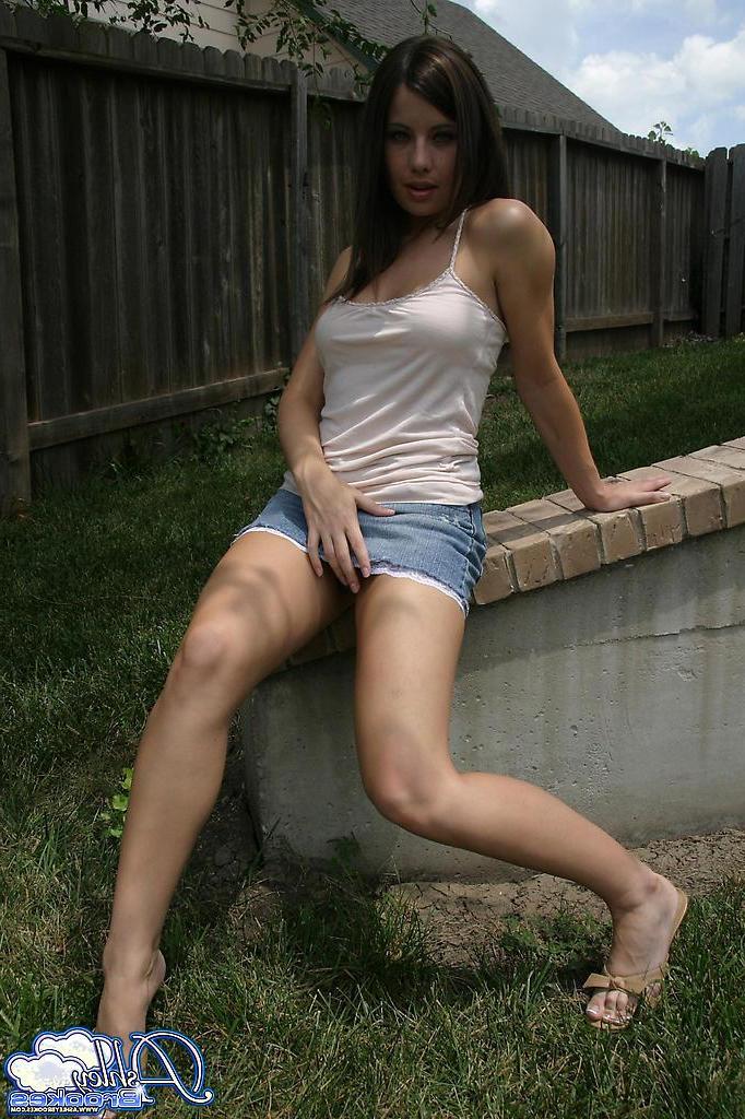 20P Pictures of Ashley Brookes showing off her long legs outside