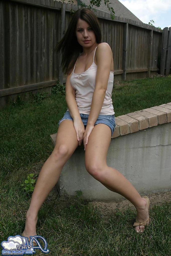 20P Pictures of Ashley Brookes showing off her long legs outside