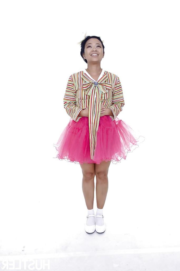 16P Asian pornstar Lucky Starr lifts up cosplay skirt for shaved cunt flashing