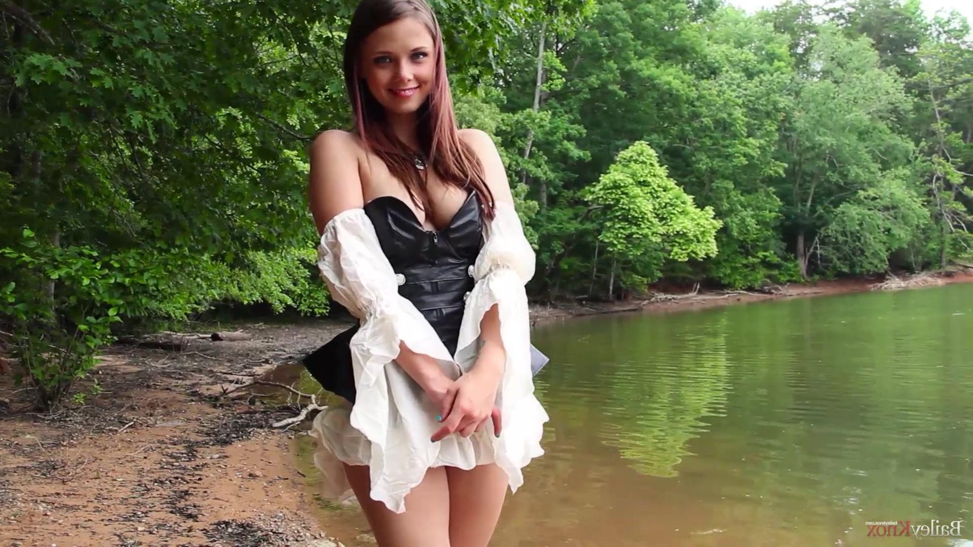 16P Brunette cutie Bailey Knox plays with herself at a park