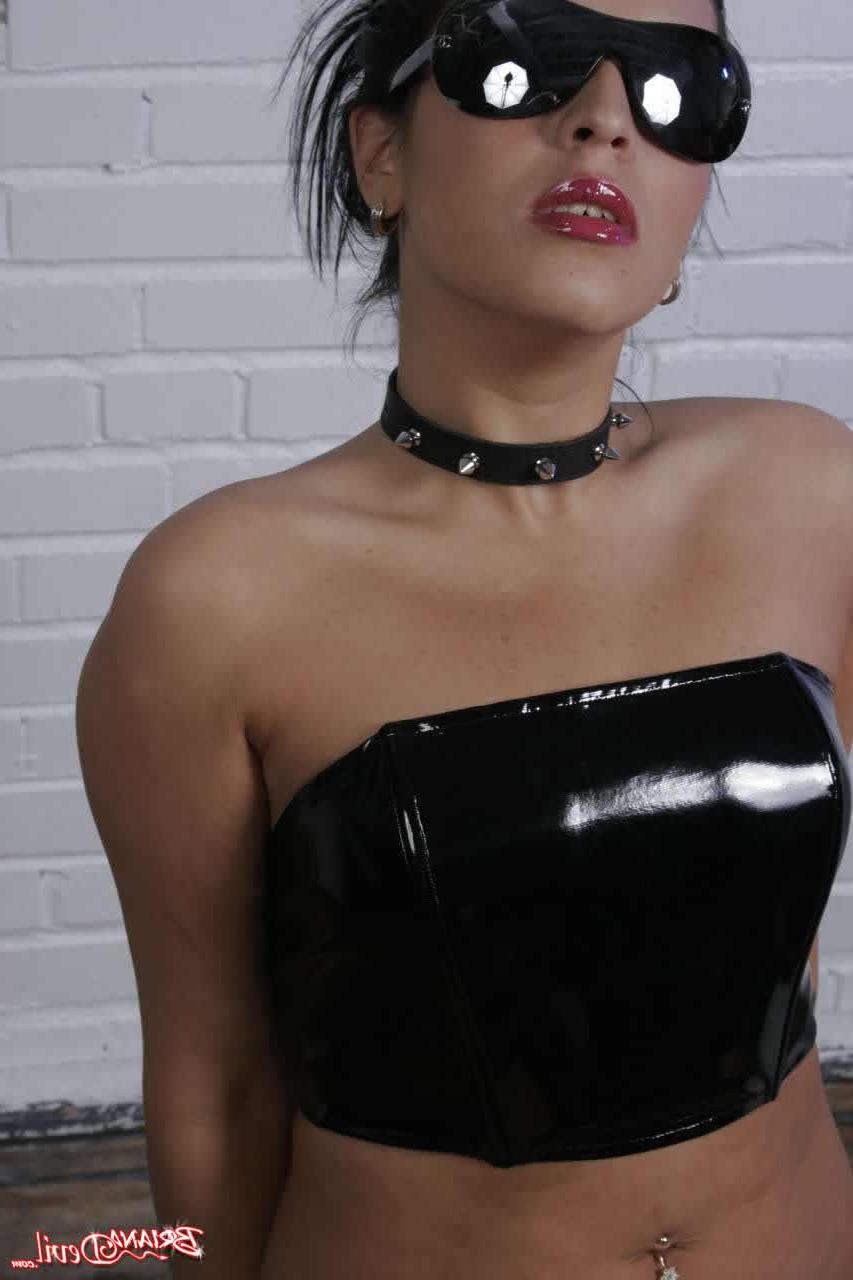 20P Pictures of Briana Devil teasing in leather