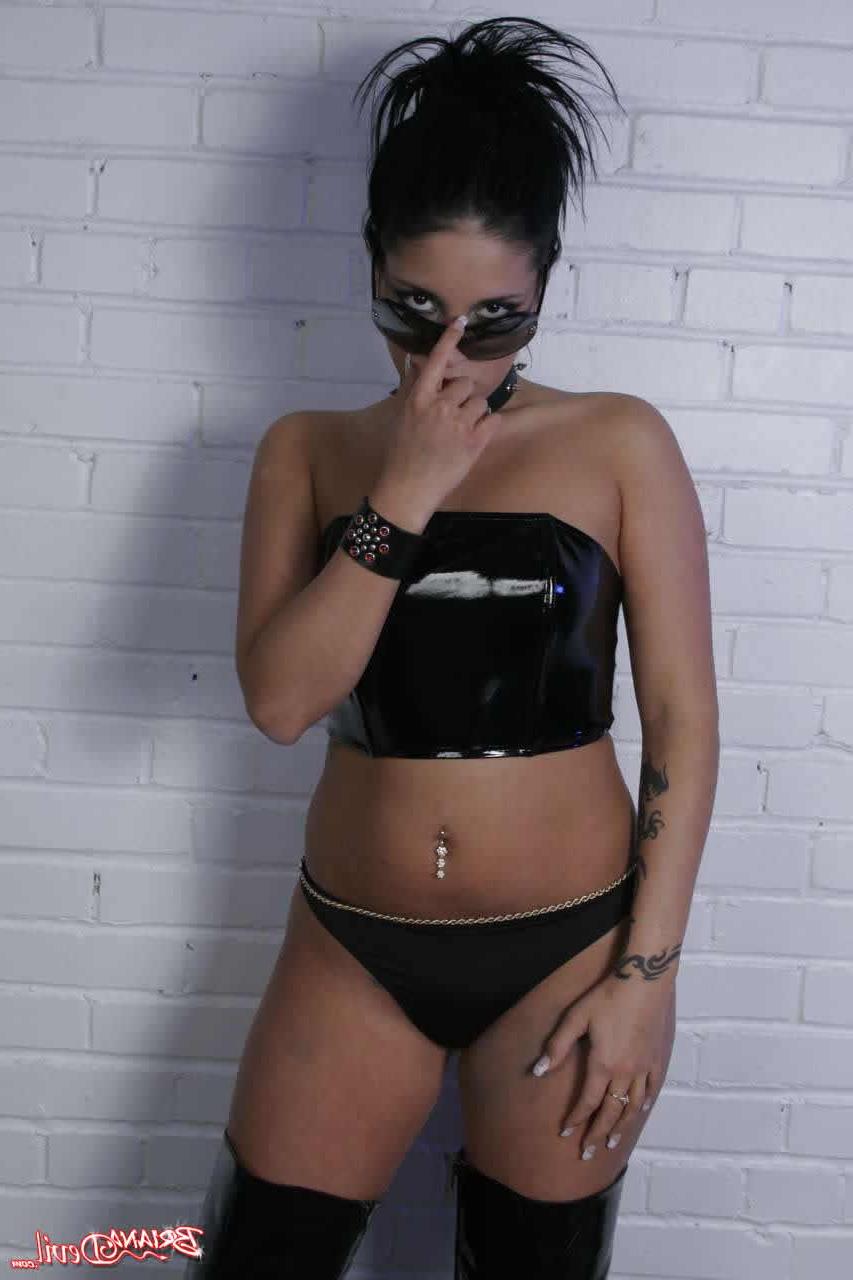 20P Pictures of Briana Devil teasing in leather