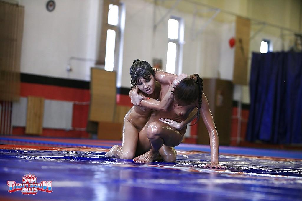 15P Oiled up petite chicks fight on the wrestling floor for lesbian pleasure