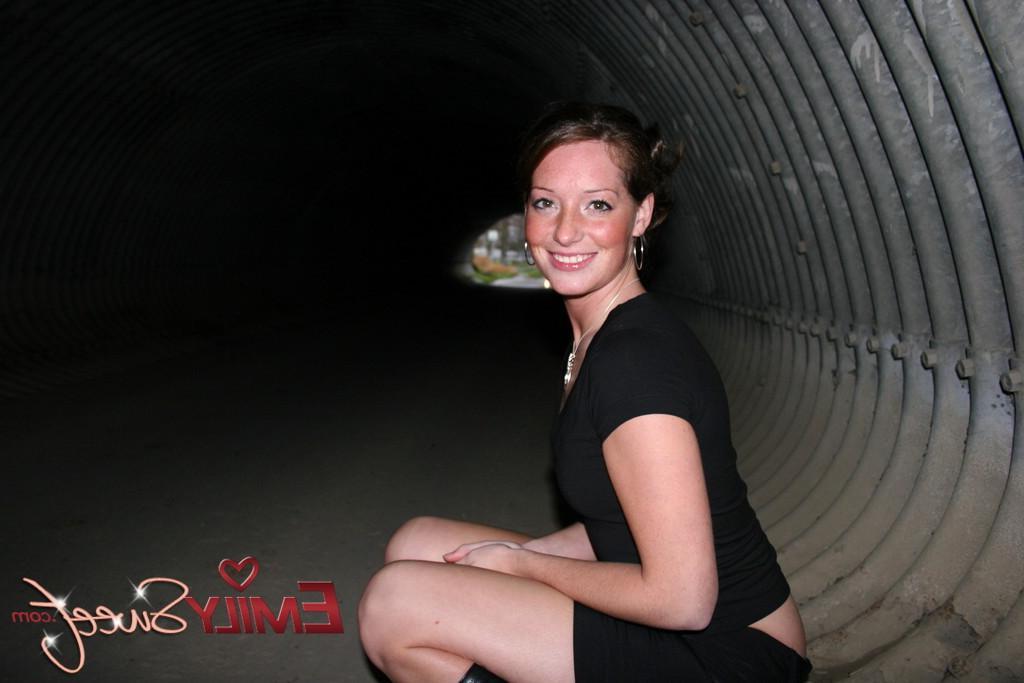 20P Pictures of Emily Sweet exposing her tits in a tunnel