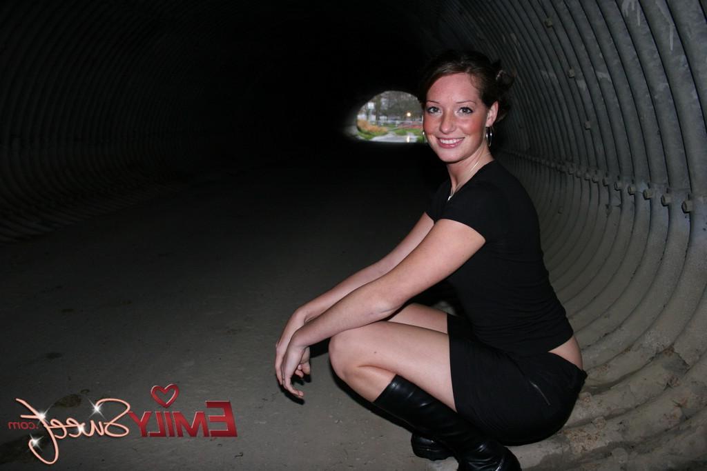 20P Pictures of Emily Sweet exposing her tits in a tunnel
