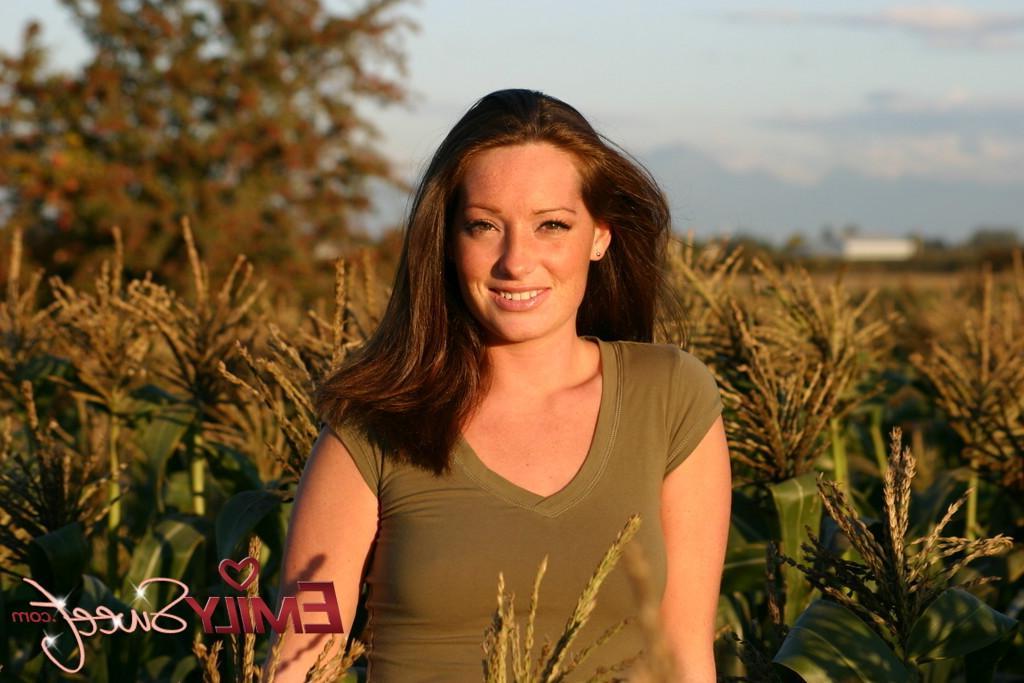 20P Pictures of Emily Sweet treading naked through a corn field