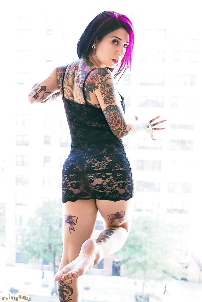 16P Tattooed exshibitionist Joanna Angel posing in nude in front of window