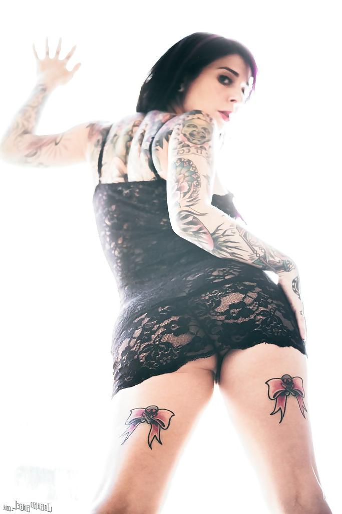 16P Tattooed exshibitionist Joanna Angel posing in nude in front of window