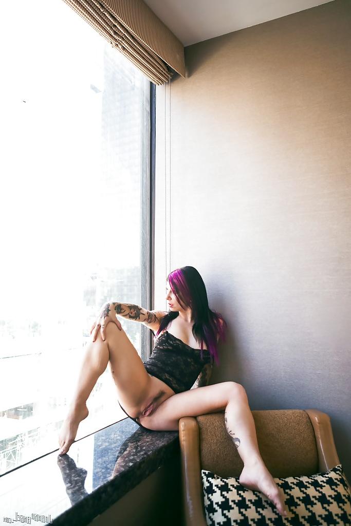 16P Tattooed exshibitionist Joanna Angel posing in nude in front of window