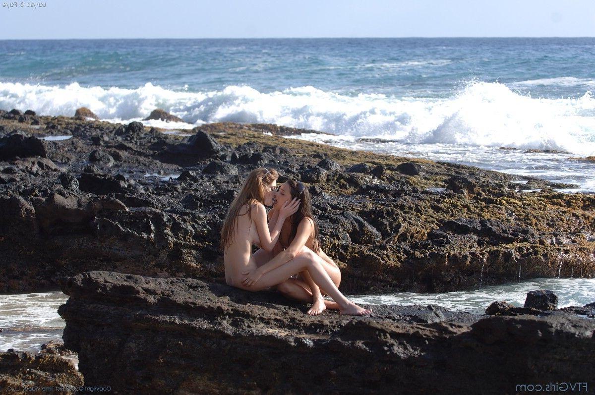 20P Pictures of two hot teen girls having fun on a beach