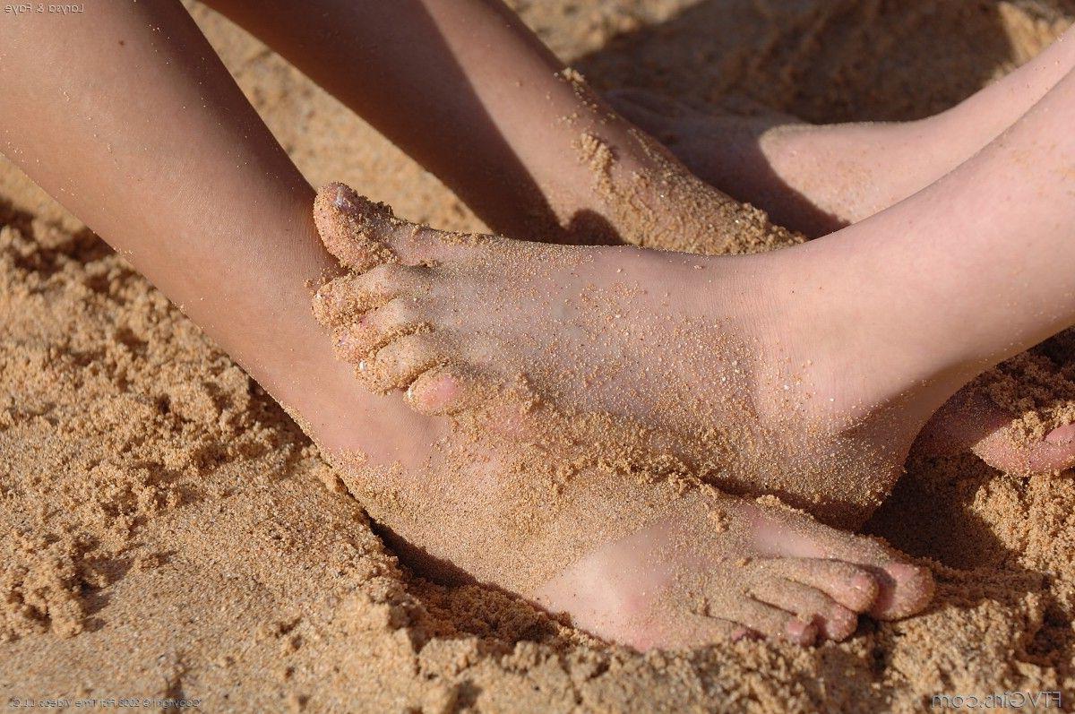 20P Pictures of two hot teen girls having fun on a beach