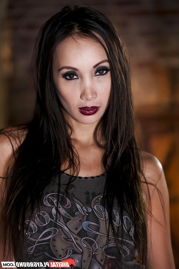 16P Fit Asian babe Katsuni is revealing her big tits while in jeans