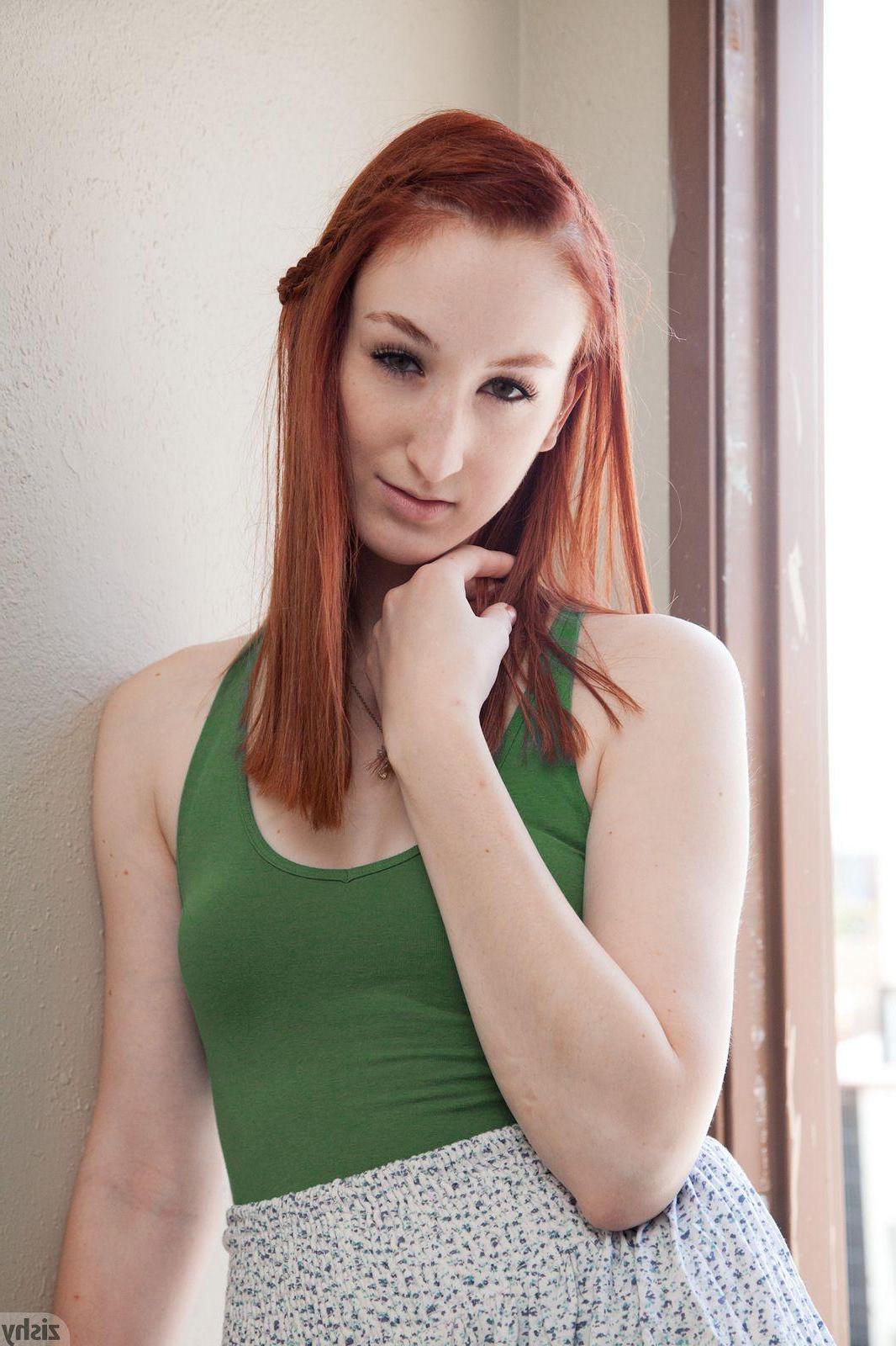 12P Redhead teen Haley Gladwell shows off her long legs and round ass on the roof top