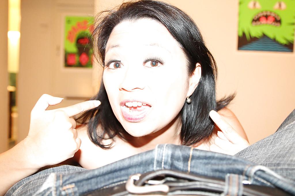 16P Salacious asian MILF strokes a large cumshot out of this hard dick
