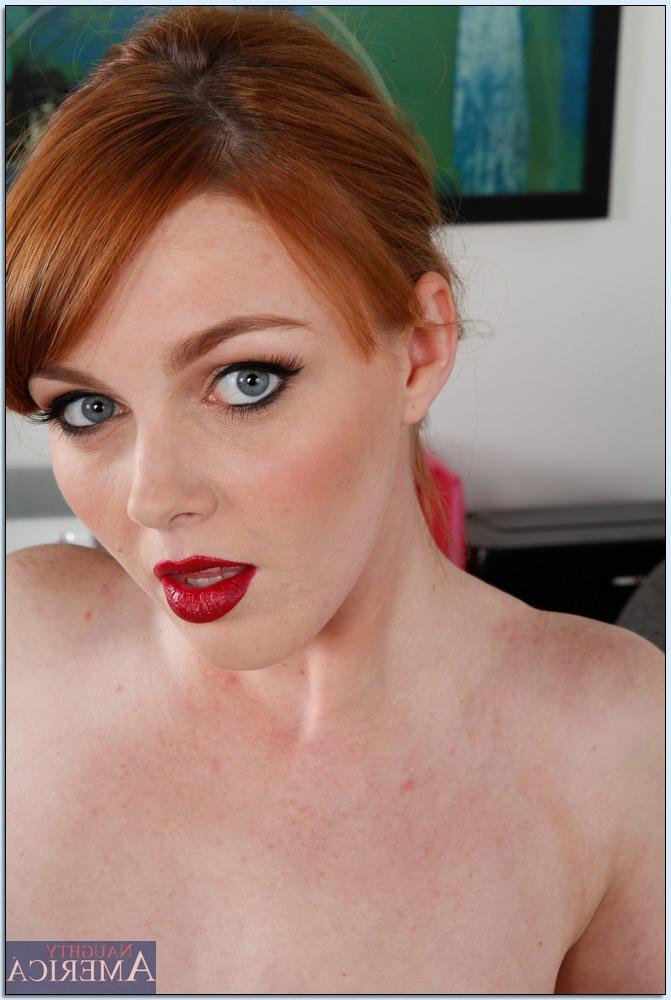 16P Foxy redhead babe Marie McCray stripping off her clothes in the office