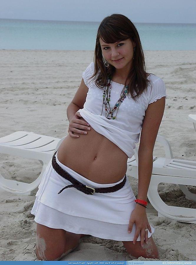 20P Pictures of teen chick Josie Model flashing on a beach