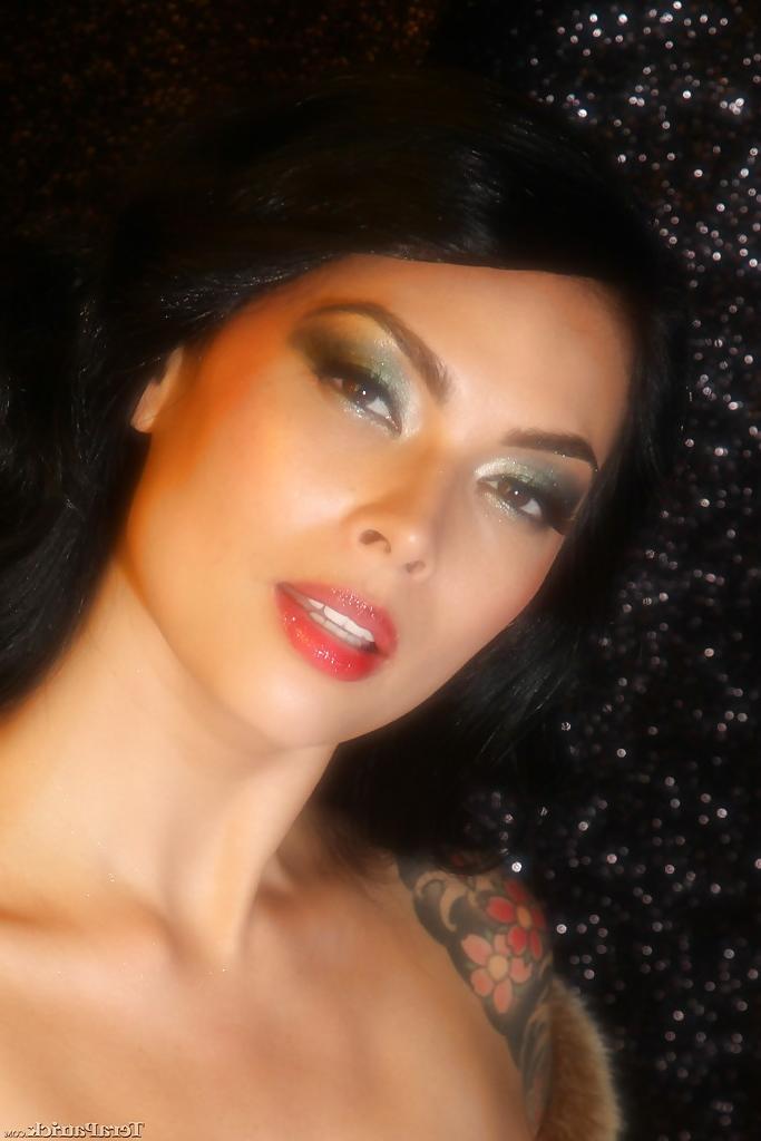 16P Busty Asian babe Tera Patrick letting large natural tits loose