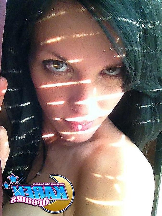 20P Karen Dreams takes pics of her big boobs and round ass by the window
