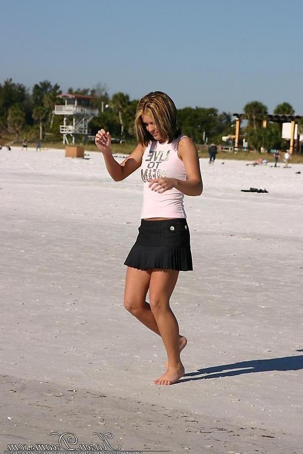 20P Pictures of Karen Dreams showing off her sexy legs on a beach