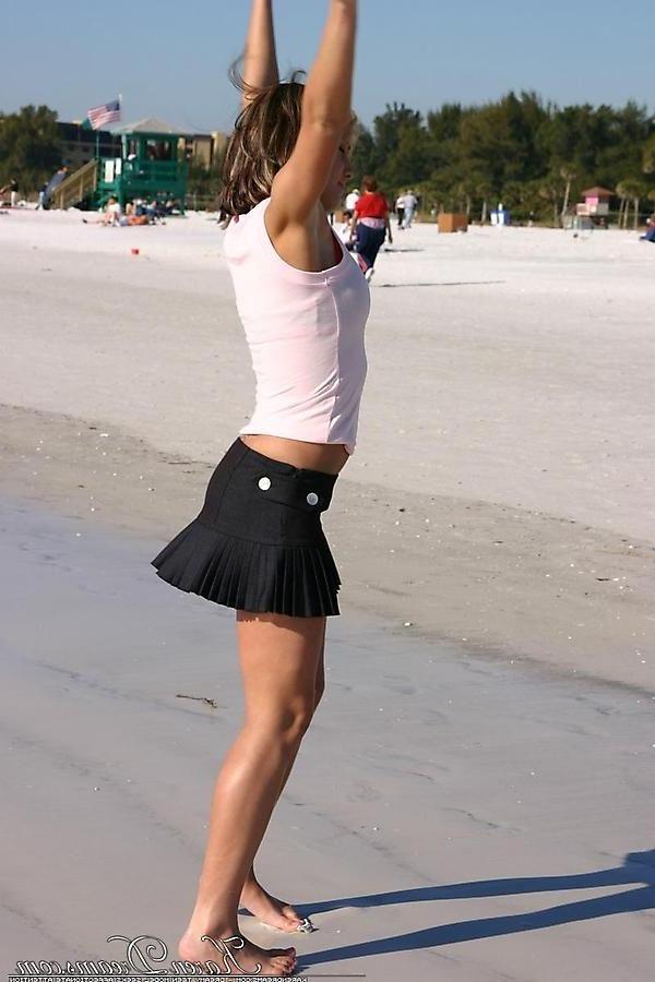 20P Pictures of Karen Dreams showing off her sexy legs on a beach