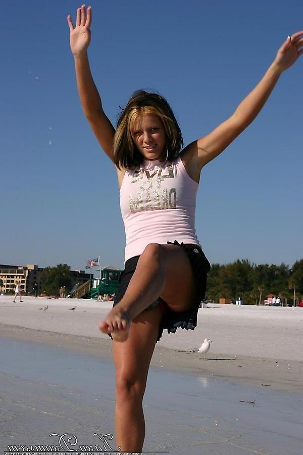 20P Pictures of Karen Dreams showing off her sexy legs on a beach