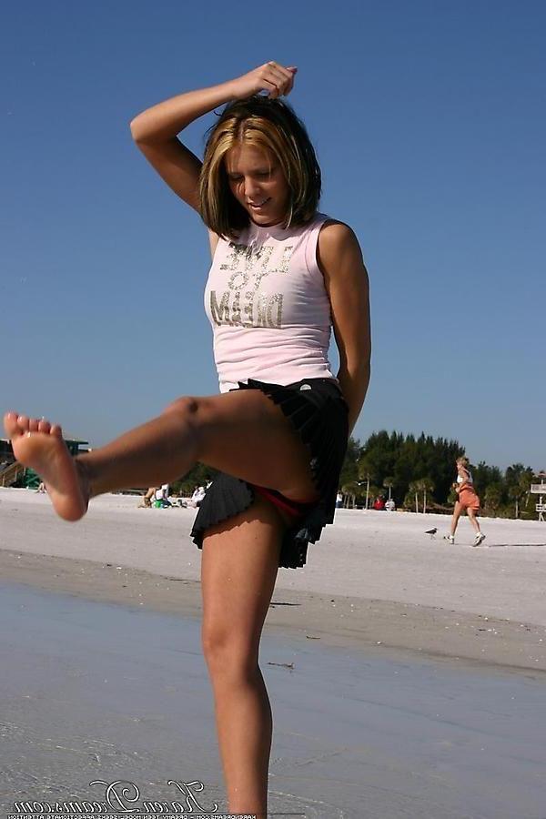 20P Pictures of Karen Dreams showing off her sexy legs on a beach
