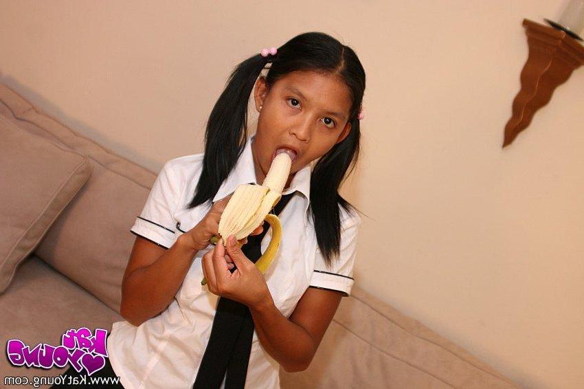 20P Kat Young strips wearing a school girl uniform