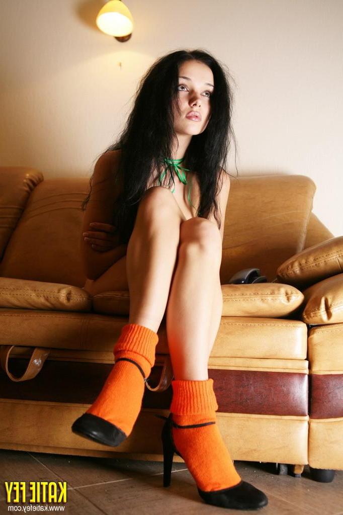 15P Pictures of Katie Fey showing off her long legs and big tits