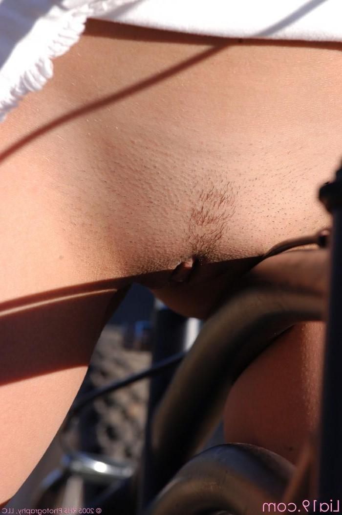 20P Pictures of Lia 19 flashing her pussy while riding a bike
