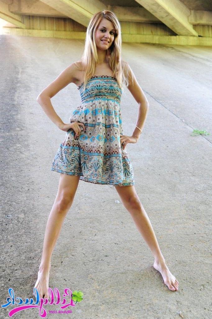 20P Pictures of teen model Lilly Luck spreading her legs outside