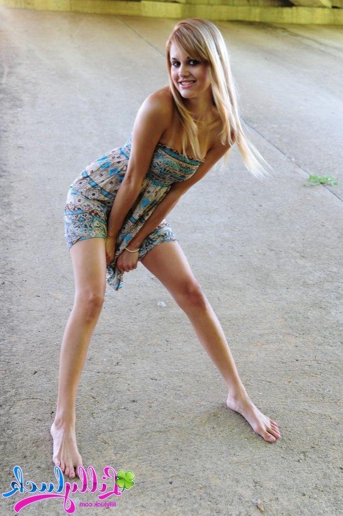 20P Pictures of teen model Lilly Luck spreading her legs outside