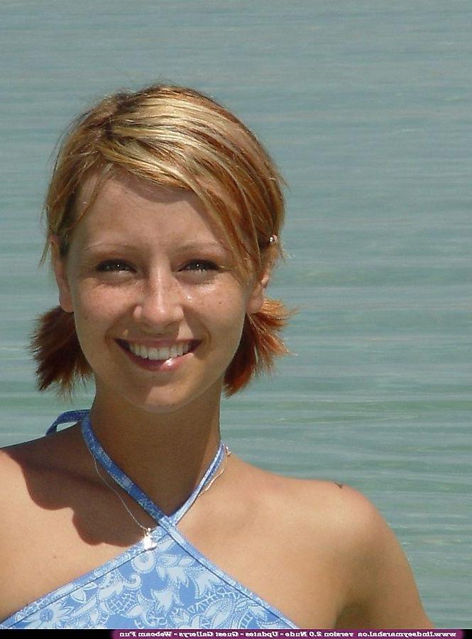 20P Pictures of teen Lindsey Marshal going for a skinny dip on a beach