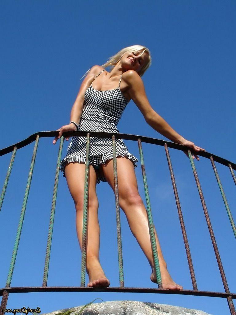 17P Pictures of Lovely Lizzy teasing with her long sexy legs