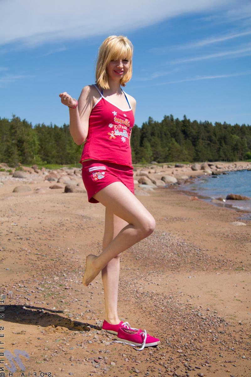 15P Horny coed Sofia H plays with her tiny tits and tight pussy on the beach