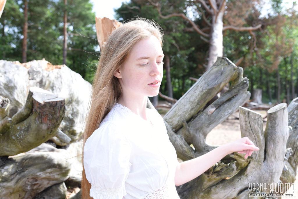 20P Hot redhead teen Gerda gets totally nude on the beach