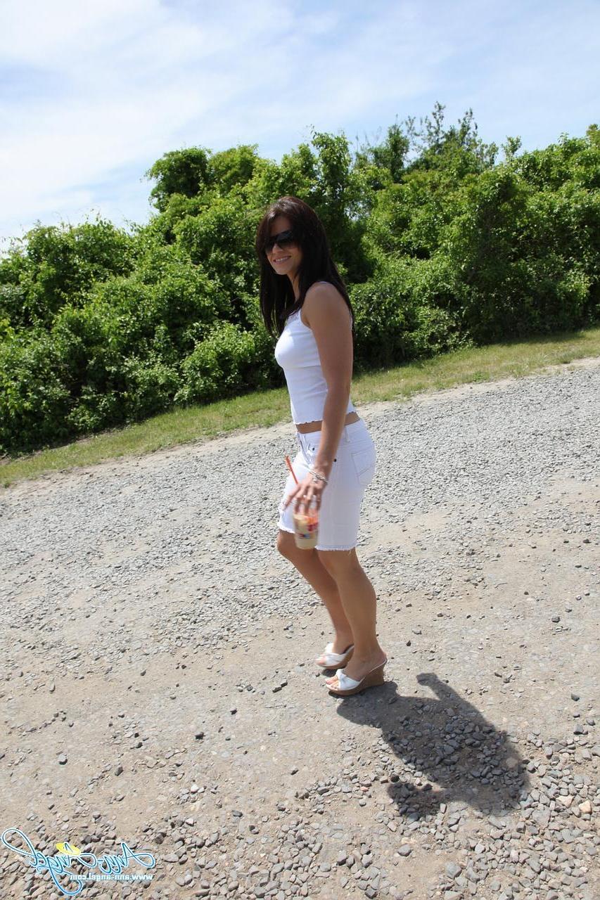 15P Ann Angel gives a tease outside with a little flash