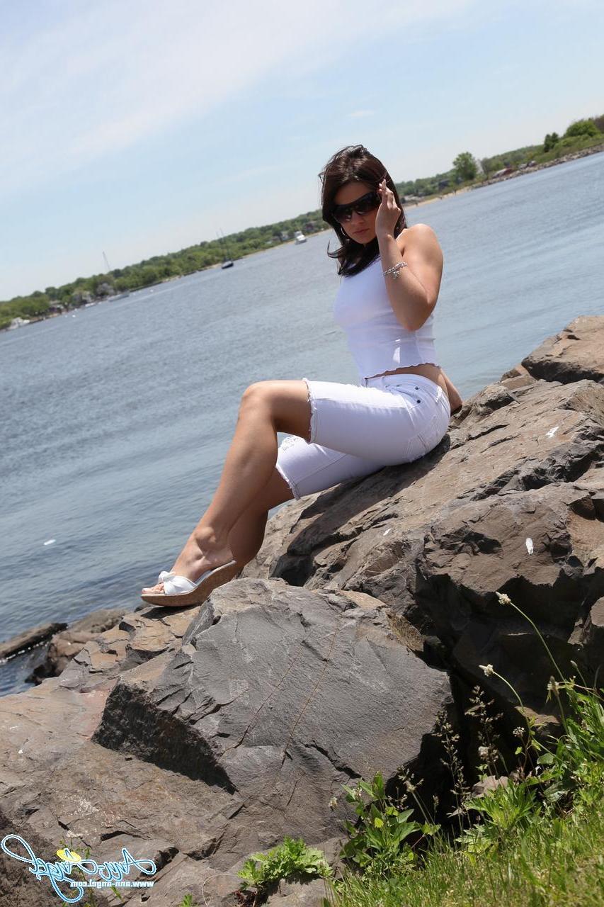 15P Ann Angel gives a tease outside with a little flash