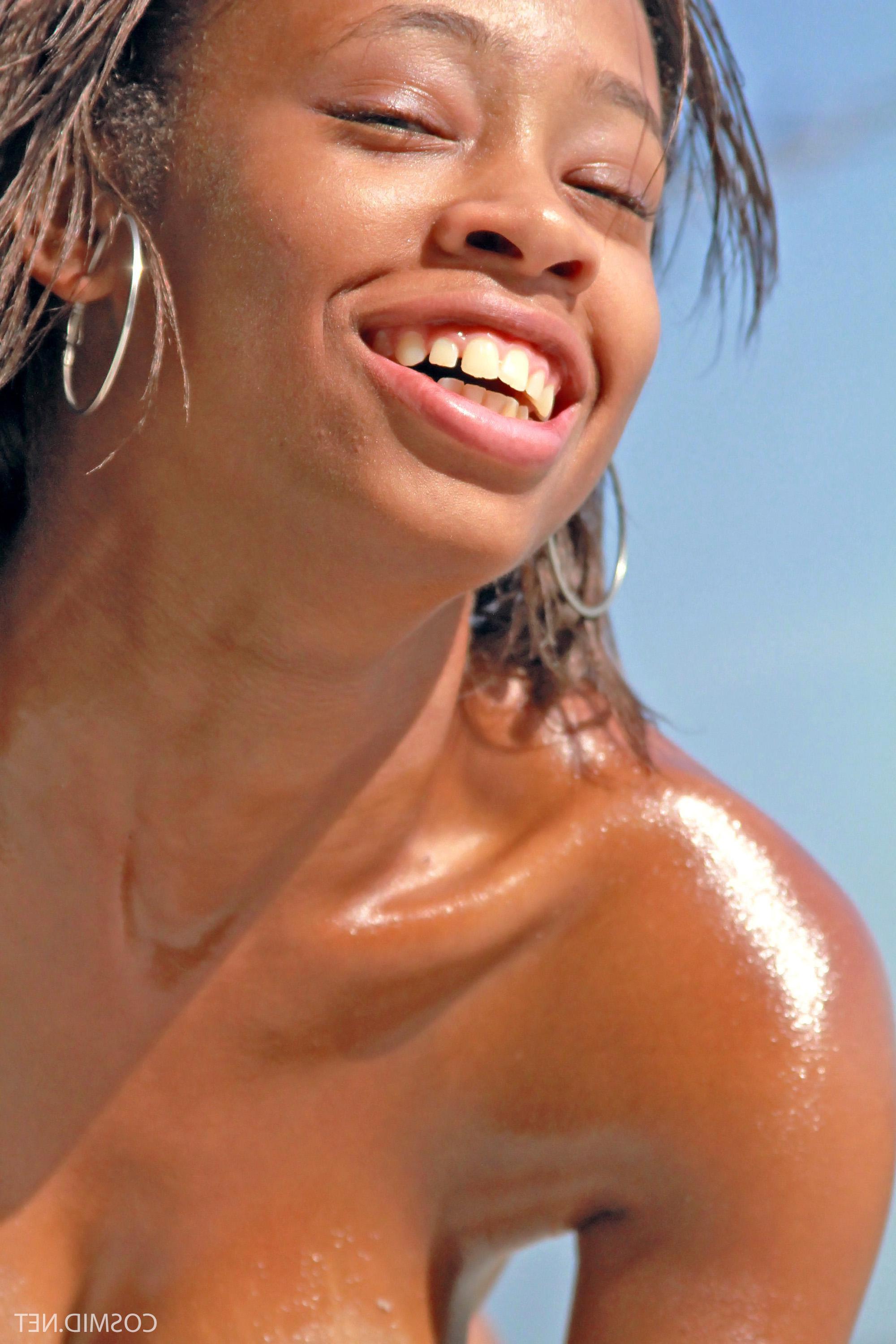 16P Ebony babe Tierra Watson has some fun in her thong on the beach