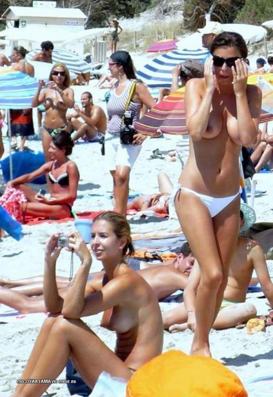 14P Pics of various sizzling hot amateur showing their big boobs on a beach