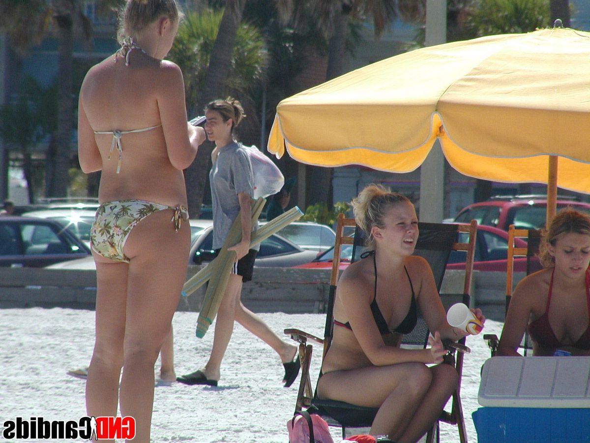 12P Pictures of hot bikini teens on a beach
