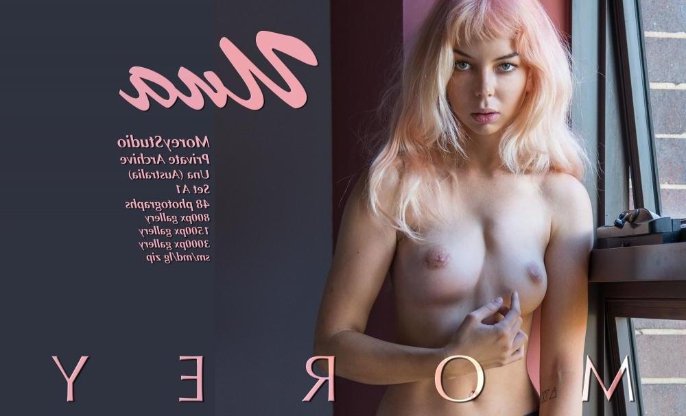 11P Blonde beauty Una exposes her boobs by the window
