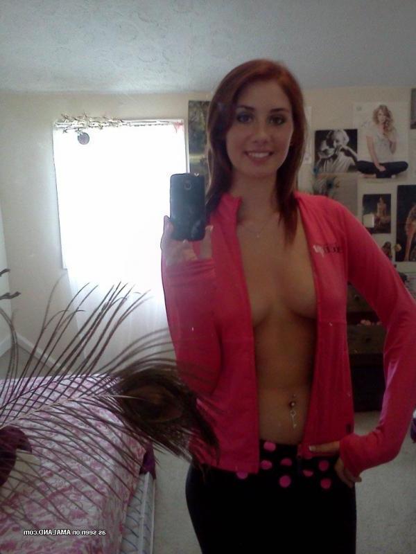 15P Redhead babe flashing her tits while camwhoring